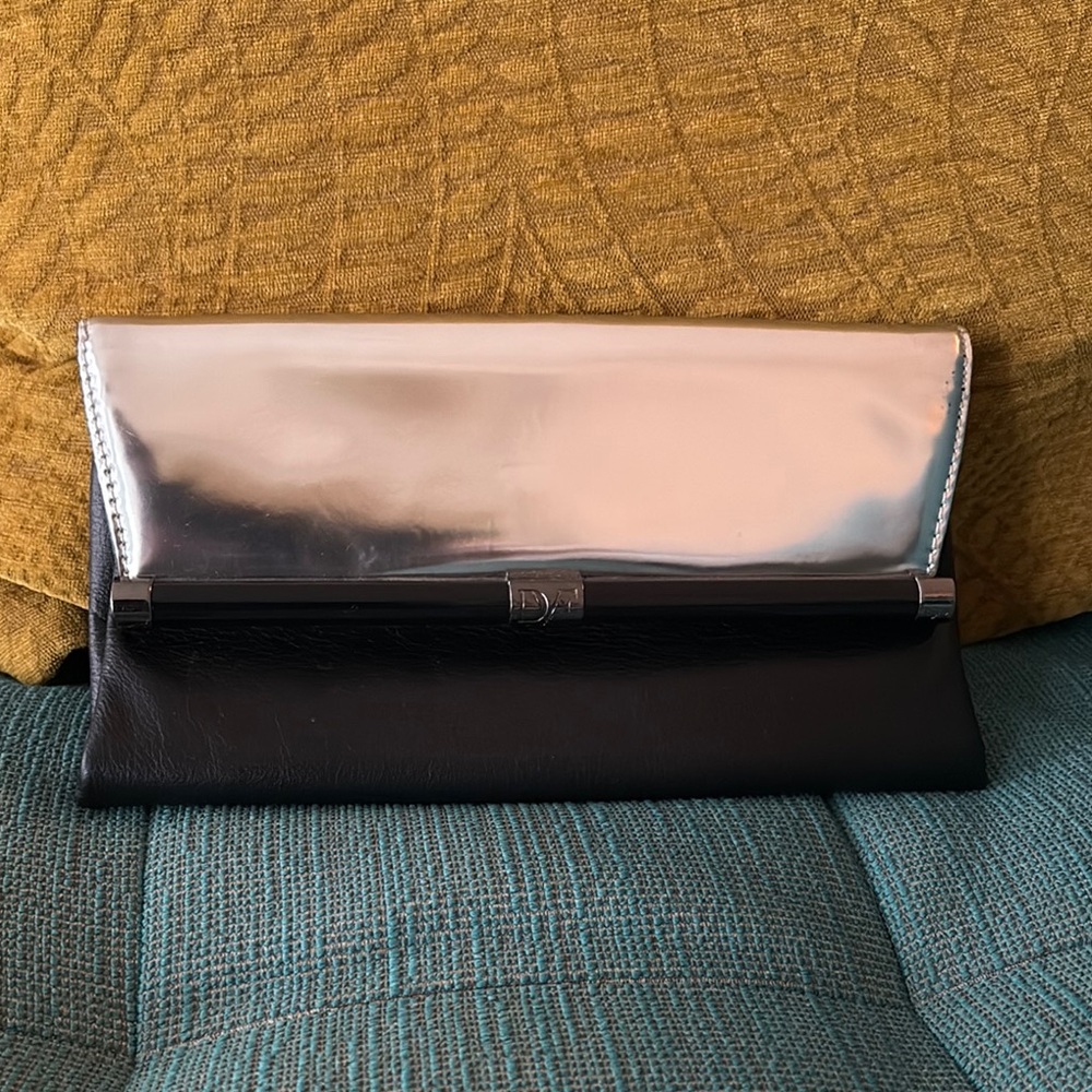 EUC (like new) DVF Elegant Black and Silver Clutch. Comes with dust bag.
